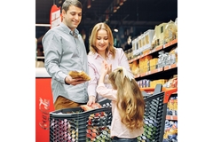 A family shopping in a grocery store.